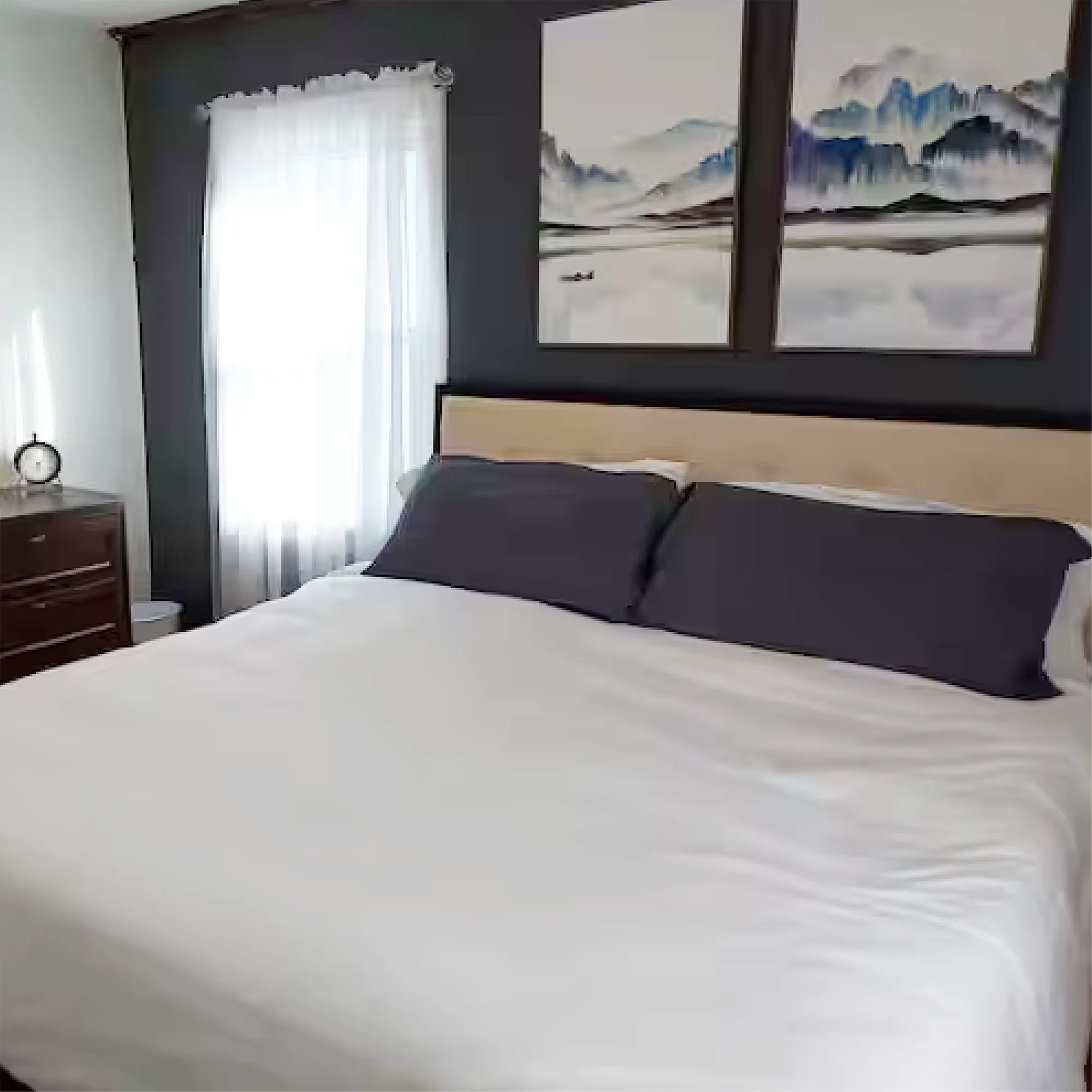 Family Comfort bedroom with king bed and mountain artwork